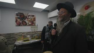 Rabbi Shepherd lighting chanukkah candles with the soldiers [upl. by Llednov916]