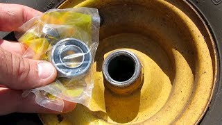 HOW TO REPLACE INSTALL WHEEL BEARINGS RIDING LAWNMOWER JOHN DEERE [upl. by Zabrine]