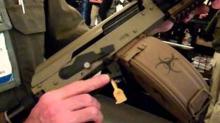 SHOT Show 2012 DoubleStar Corp ZombieX AK with Chain Saw [upl. by Dettmer377]