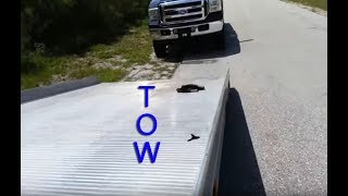 Using a Roll back Flat bed Tow Truck Moving Repo cars Wheel lift [upl. by Elyac814]