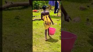 Doing laundry in the village 🇰🇪 ASMR shortsvillagelifeafricablackandwhitecouplelove [upl. by Eilime]