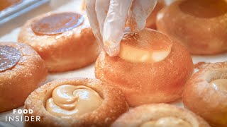 Hundreds Of LecheFlanFilled Doughnuts Are Made In A New York Apartment [upl. by Burnley797]