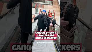 CANUCKS STICKERS ON OILER FANS RIDING ESCALATOR 🏒🥅 [upl. by Alyss842]