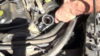 How to replace a Thermostat on a 1997 Plymouth Neon [upl. by Leirud736]