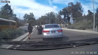 Watch The Bizarre Moment a Woman Walks Out of Her Moving Car [upl. by Esil]