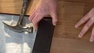 How to Install Laminate Flooring Part 1  Tapping Block [upl. by Aiem]