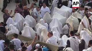 Jewish worshipers pray at Jerusalems Western Wall [upl. by Ferdy]