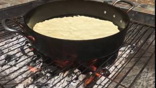 Castiron skillet pizza cooking on the firepit [upl. by Nahn527]