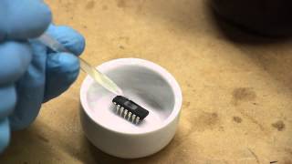 Decapping ICs removing epoxy packaging from chips to expose the dies [upl. by Gnoh930]