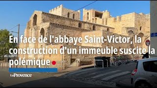 En face de labbaye SaintVictor la construction dun immeuble suscite la polémique [upl. by Pinchas907]