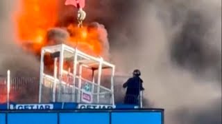 Man rescued from burning highrise building under construction by crane operator by the roof [upl. by Karli60]