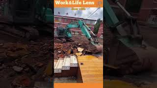 An excavator demolishes a houses concrete floor effortlessly breaking it down into rubble [upl. by Ilenna]