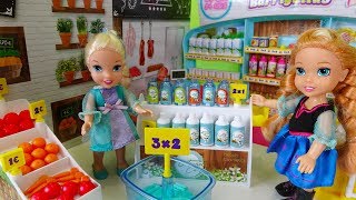 Elsa and Anna toddlers go shopping at the supermarket and buy toys [upl. by Erwin954]