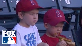 Kid struggles to eat a hot dog at baseball game [upl. by Abehs]