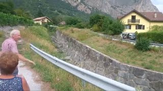 Watch People Stand By As Mudslide Flows Into Swiss Town [upl. by Vijnas905]