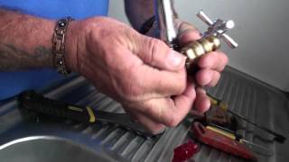 Repairing a dripping tap by washer replacement and regrinding seat [upl. by Meelak]