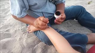 Getting a Henna tattoo on Legian Beach Bali How not to get ripped off in Bali [upl. by Nerat]