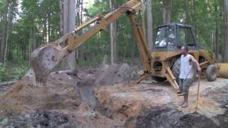 CASE 580C BACKHOE  Installing a culvert pipe [upl. by Tizes]