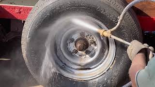 Wet sandblasting a tire rim while still on the trailer [upl. by Norrab]