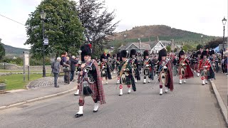 Drum Major Roland Stuart leads the Massed Pipe Bands to the 2019 Braemar Gathering in Scotland [upl. by Adora]