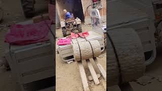 Grain crushing round stone loading process [upl. by Iralav]