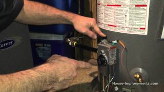 How To Light A Gas Water Heater Pilot Light [upl. by Ardnama]