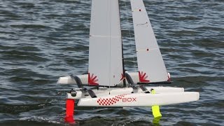 Foiling  radio controlled One Metre trimarans with Z and kinked foils [upl. by Ahsilav999]