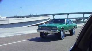 Box 89 Chevy Caprice Choppin on The Highway on 26s [upl. by Ellerred]