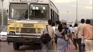 Delhi DTC diesel bus service circa 1998  commuters board moving Blueline and Redline buses [upl. by Atteynek]