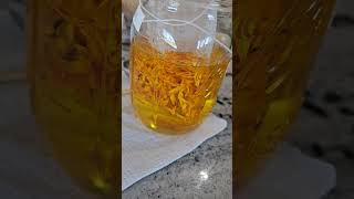 Straining the Calendula oil calendula diyskincare [upl. by Etnoval]