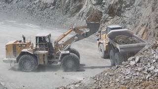 Caterpillar 988H and Dump Truck Caterpillar and Komatsu in action in the quarry [upl. by Suehtomit835]