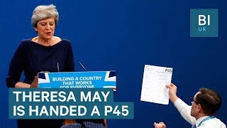 Comedian Lee Nelson hands Theresa May a P45 during conference speech [upl. by Eniarrol]