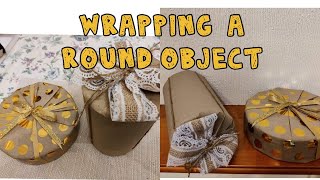 HOW TO WRAP A ROUND OR CYLINDER GIFT OR OBJECT  WRAPPING A ROUND BOX [upl. by Trout108]