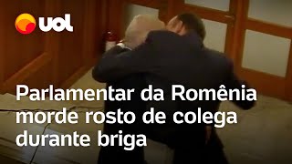 Político morde rosto de colega durante briga na Romênia veja vídeo [upl. by Luby414]