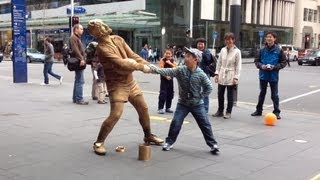 Gold Rugby player Living Statue busker  Auckland clip 1 [upl. by Hildegarde487]